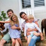 Happy-family-at-home-with-their-dogs-000084931157_Medium